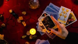 Minsk, Belarus - November 2021: the fortuneteller holds the Death tarot card in his hand.